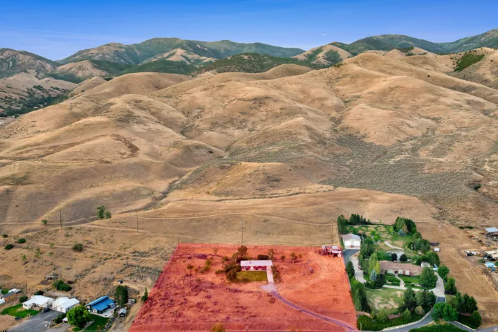 Expansive property featuring a single-story residence and vast open land