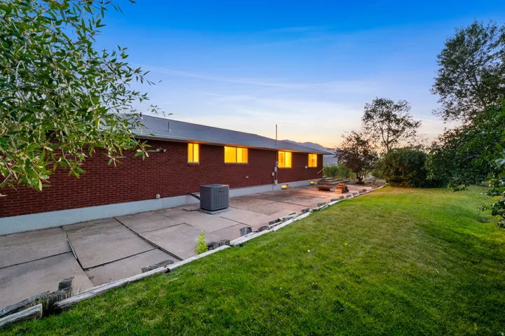 Brick exterior with a large patio area