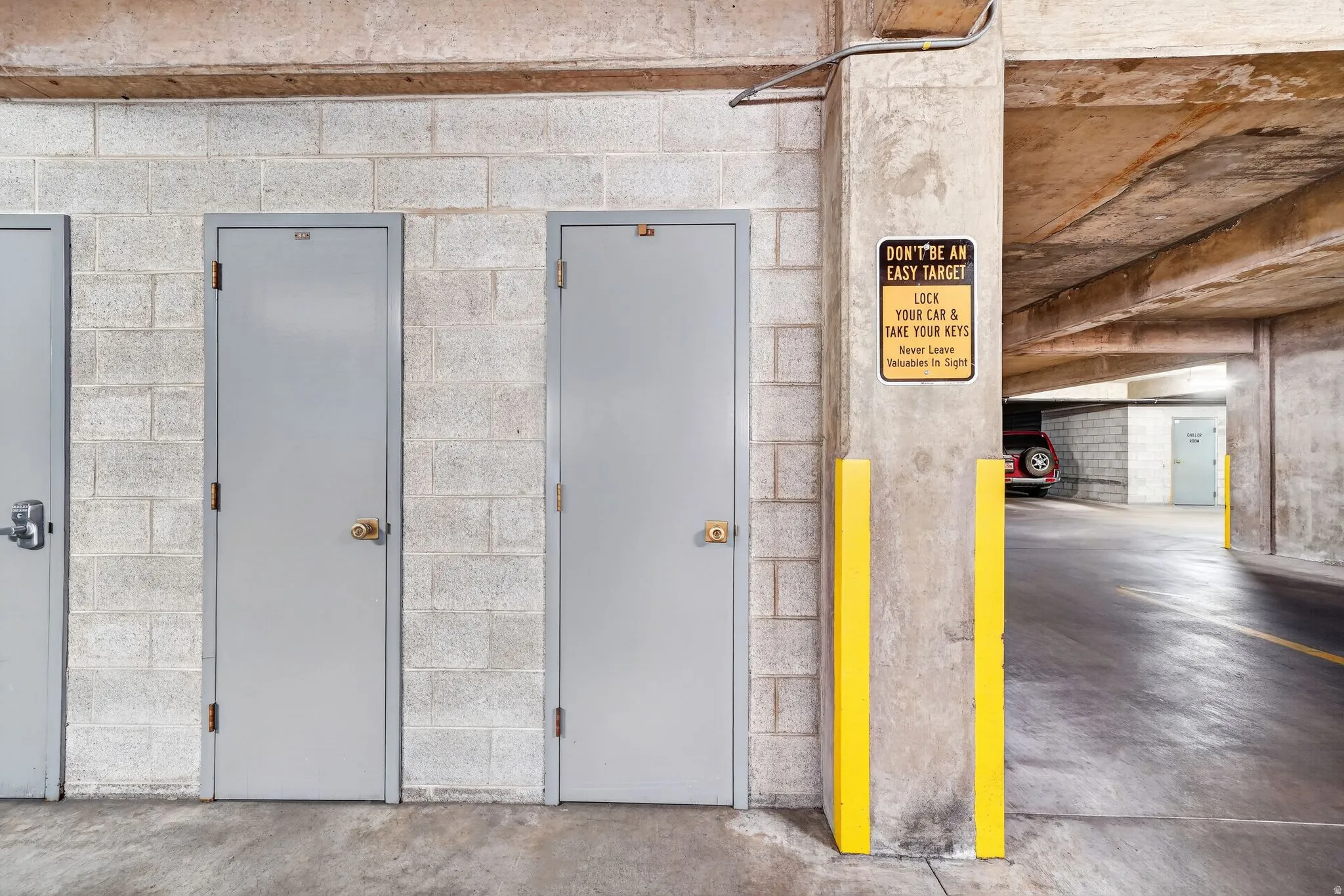 Concrete block wall with multiple gray doors