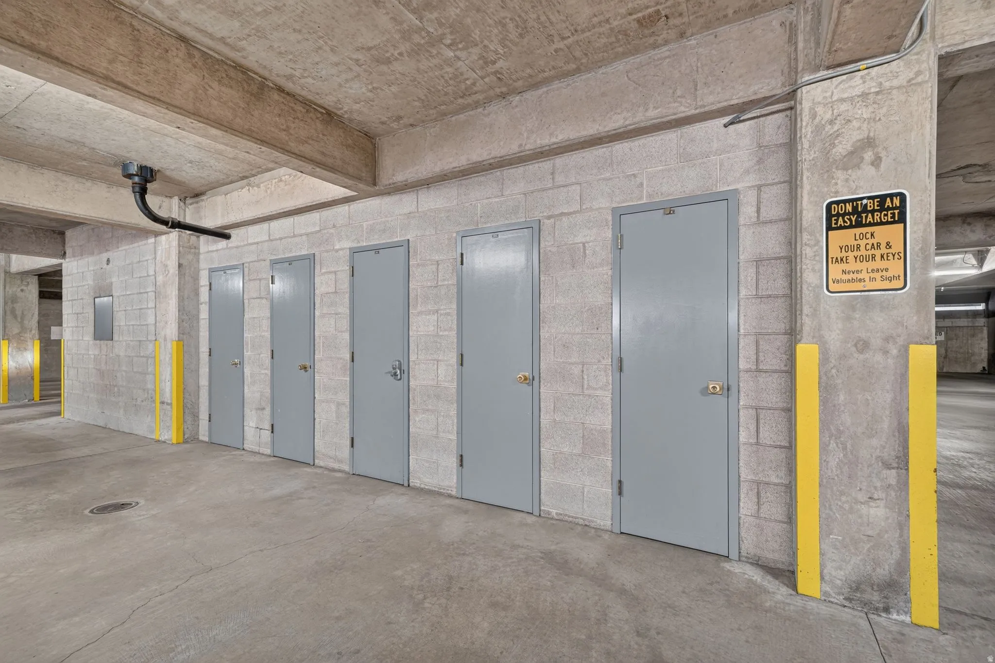 Concrete block wall storage units with grey metal doors