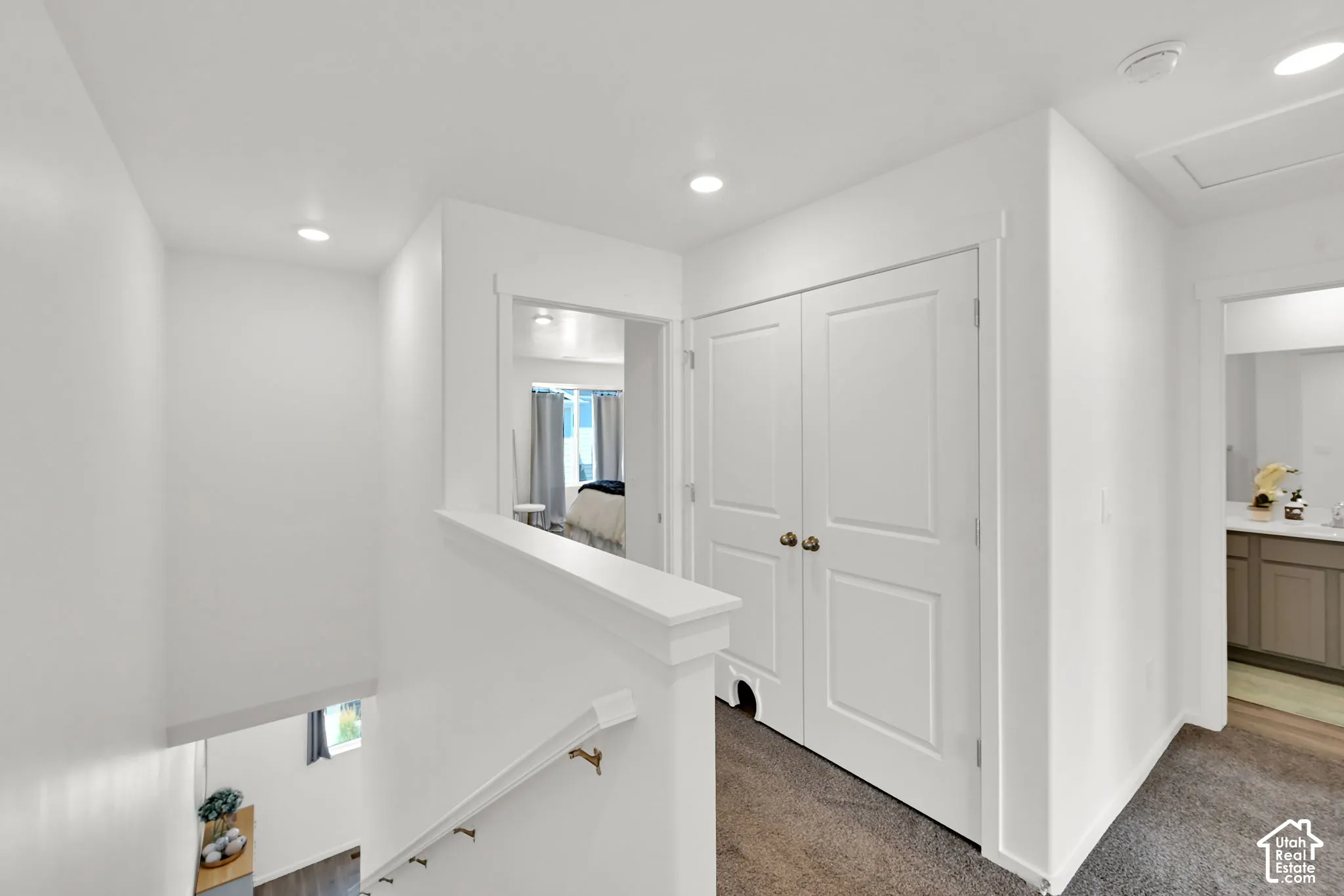 Upper landing featuring recessed lighting, a neutral color palette, and carpet flooring
