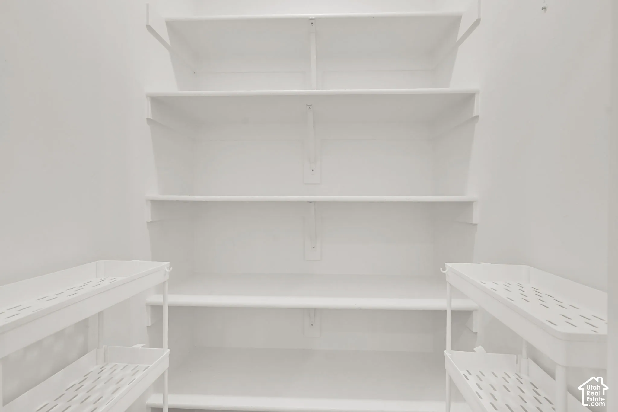 Built-in white shelving system featuring multiple tiers