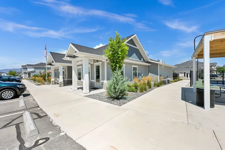 Modern gray siding exterior with white trim and stone accents