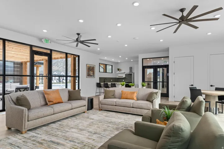 Spacious open-concept common area featuring recessed lighting and multiple ceiling fans