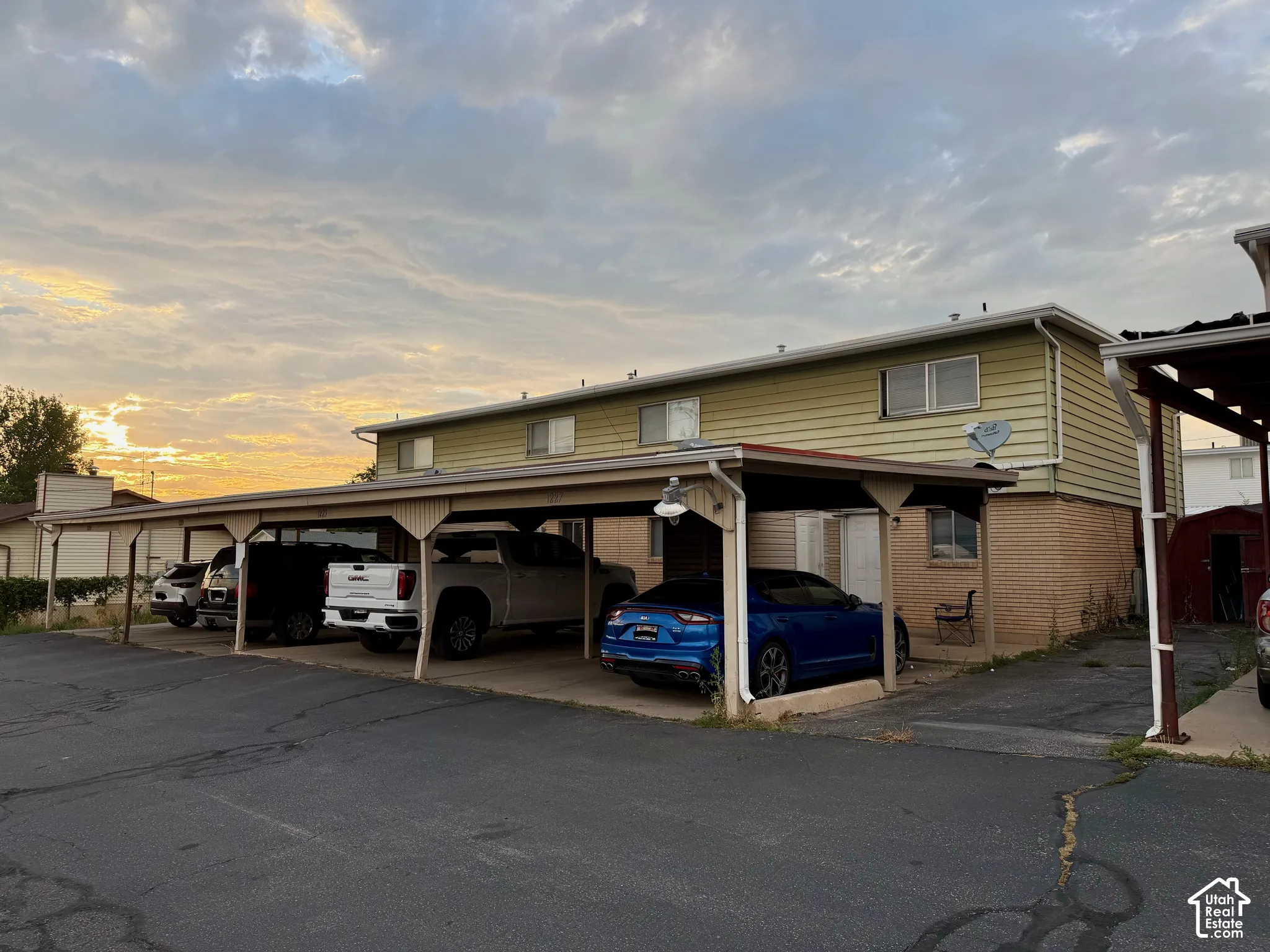 Multi-unit structure with a covered carport offering multiple parking spaces