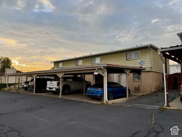 Multi-unit structure with a covered carport offering multiple parking spaces