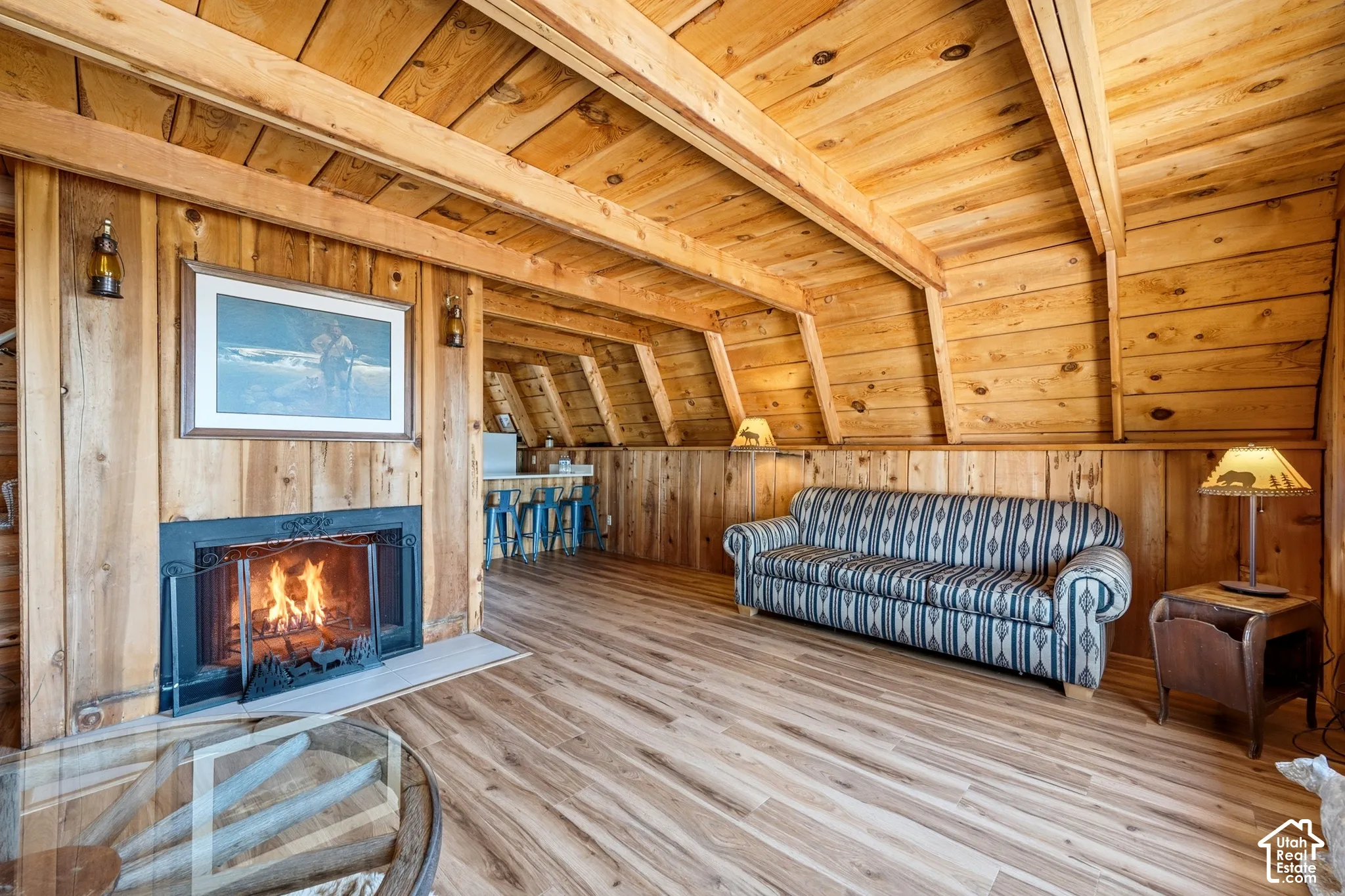Fireplace & Kitchen Flow - The fireplace divides the living area from the kitchen and breakfast bar, keeping the main level open end to end.