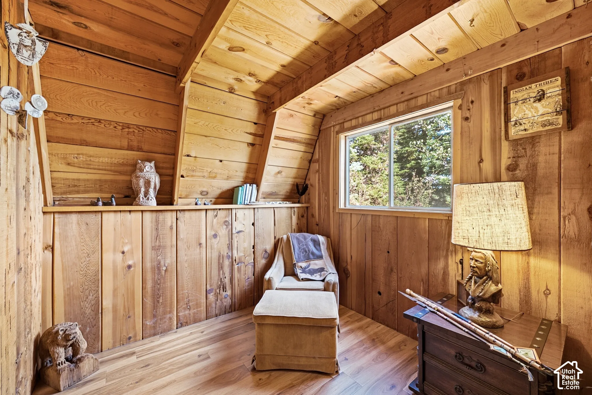 Sitting Room - Quiet sitting room with pine walls, a wide window ledge, and a window overlooking the surrounding aspens.