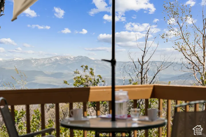 View from the Deck - Snow-capped peaks and rolling canyon terrain visible from the dining area.