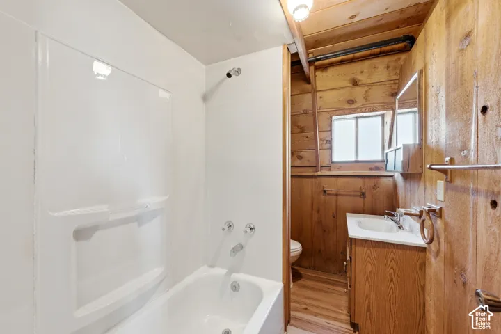 Full Bath - Main-level full bath with a tub-shower combination, vanity with storage, and a privacy window.