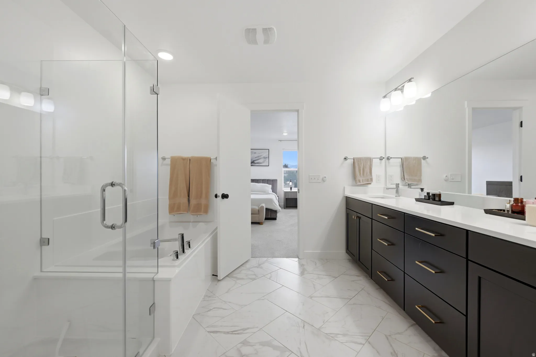 Master bath with separate tub and shower, extra long dual sink vanity