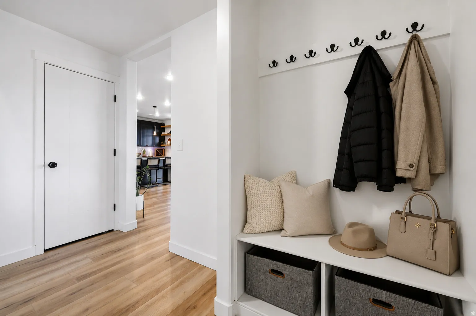 Built-in entryway bench with integrated coat hooks