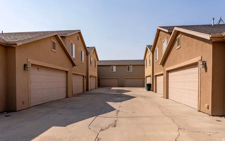Concrete driveway providing access to multiple attached garages