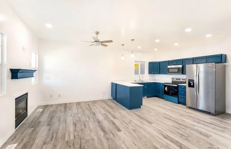 Open-concept living space with wood-finish flooring