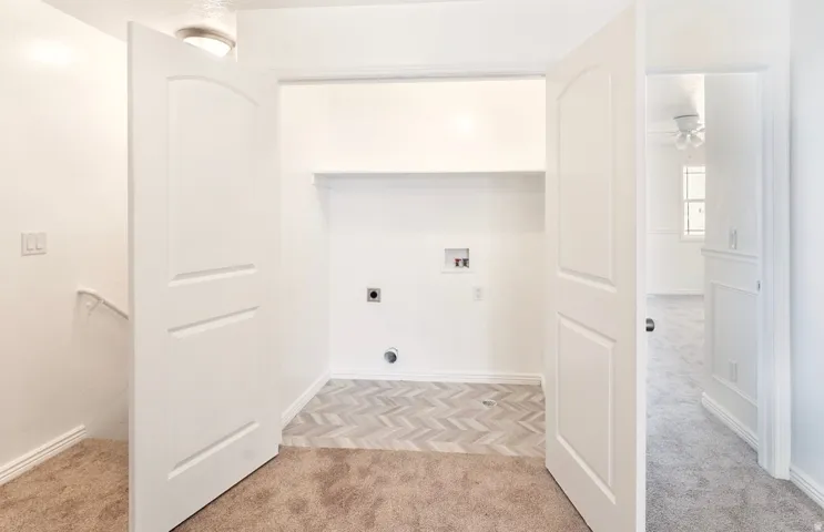 Primary Bathroom Suite with Custom Tile Flooring and Dual Vanity Layout
