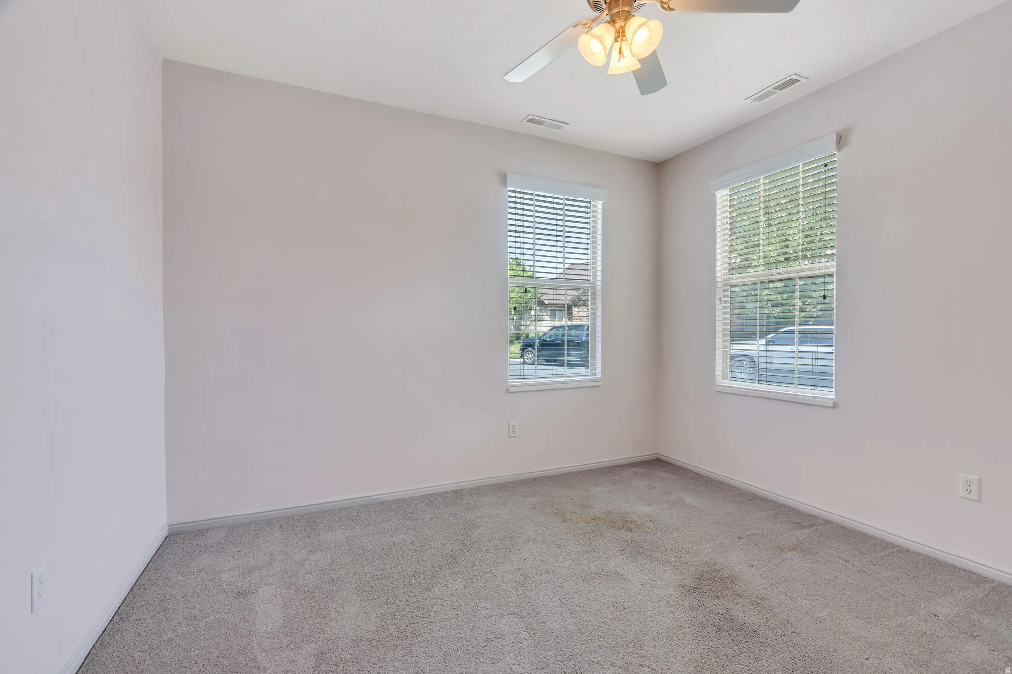 Room featuring neutral carpeting and light-toned walls