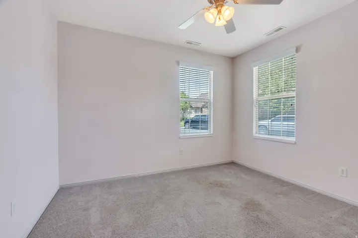 Room featuring neutral carpeting and light-toned walls