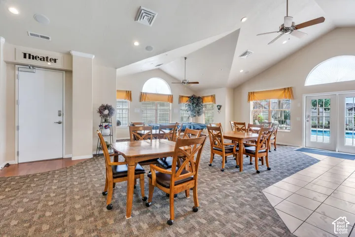 Spacious communal area featuring vaulted ceilings, recessed lighting, and multiple ceiling fans