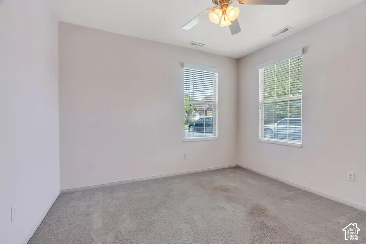Room featuring neutral carpeting and light-toned walls