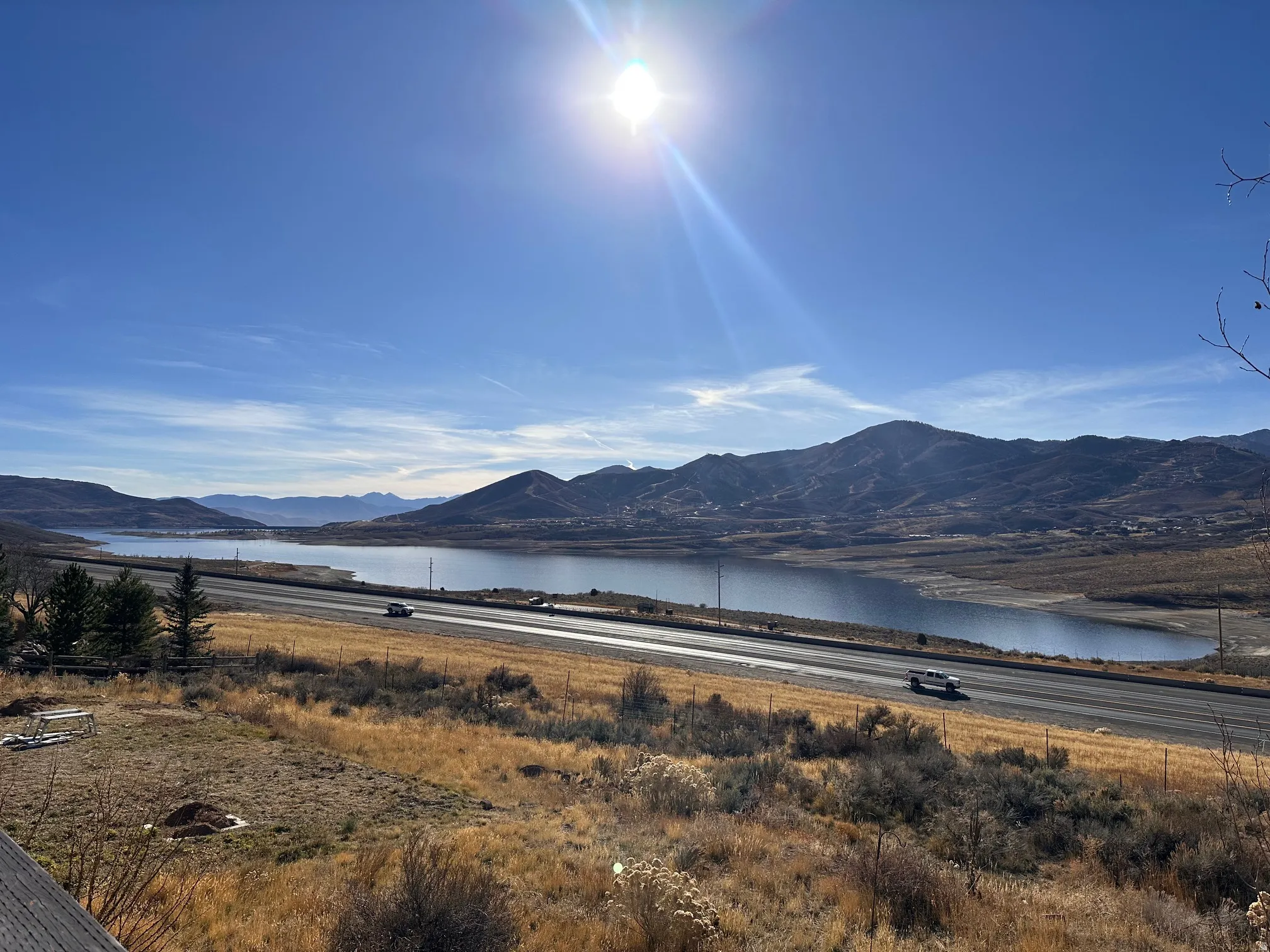 Expansive lake and mountain scenery with a clear sky backdrop