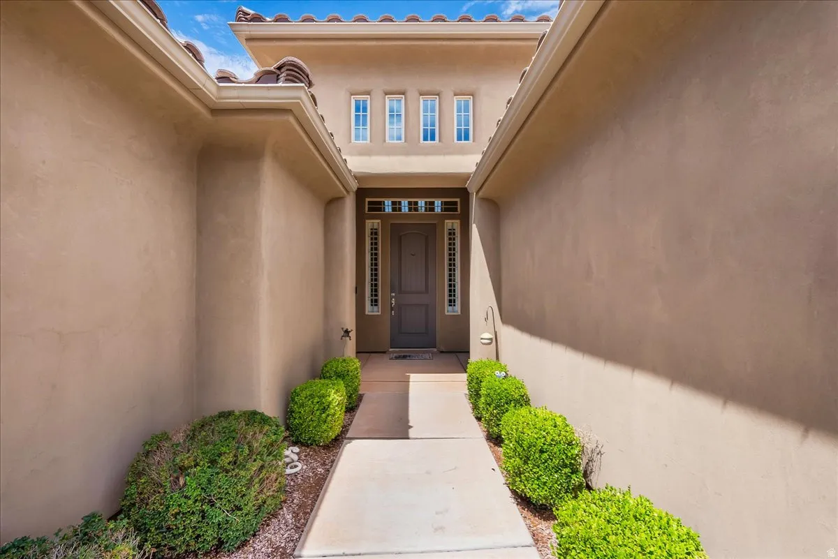 Stucco exterior with a tiled roofline