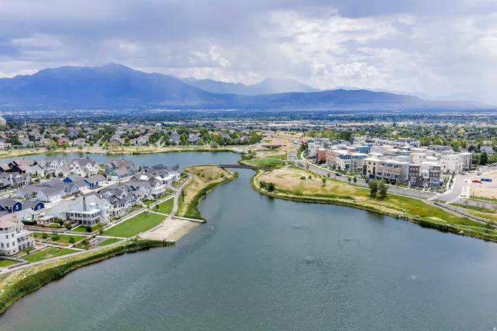 Expansive body of water bordered by residential properties and green spaces