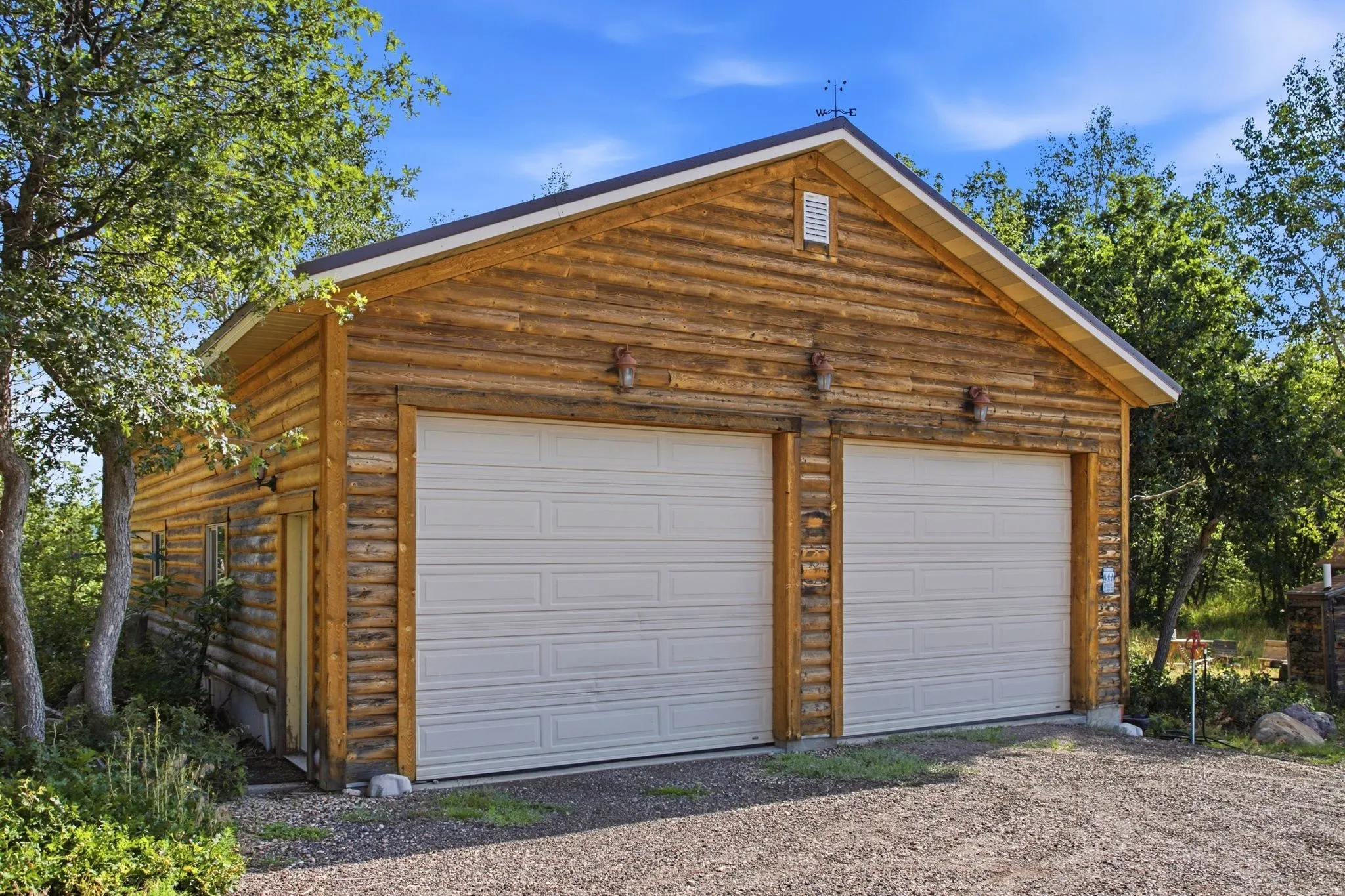 Massive oversize garage for vehicles and RV's. Workshop or whatever a man-cave needs these days.