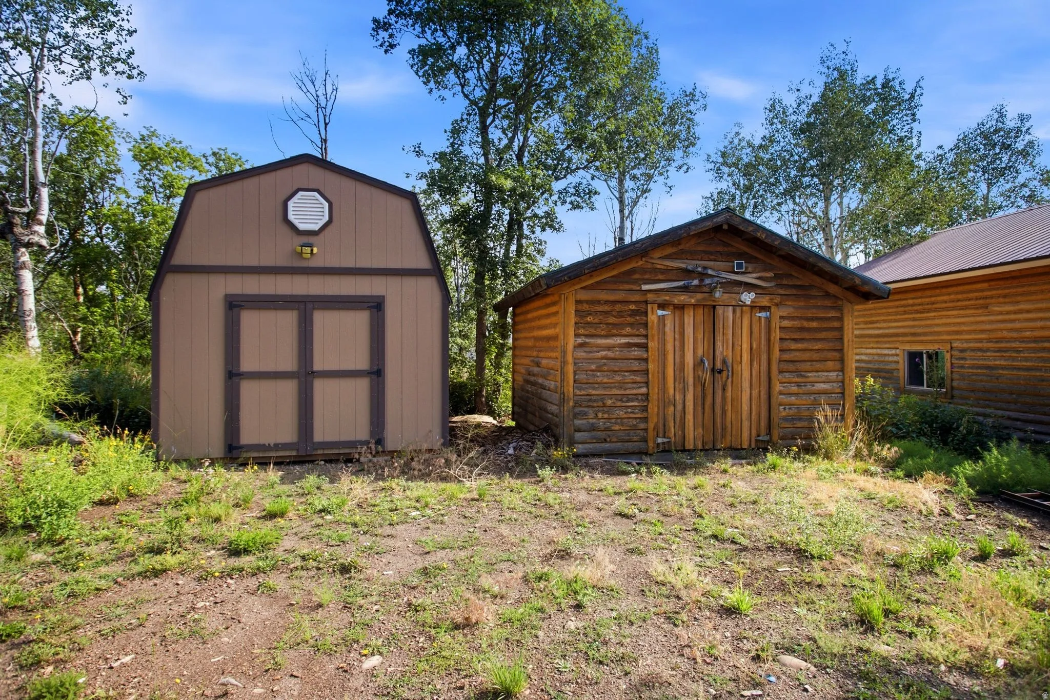 Storage shed and wood barn/complete with firewood to get you started this winter.