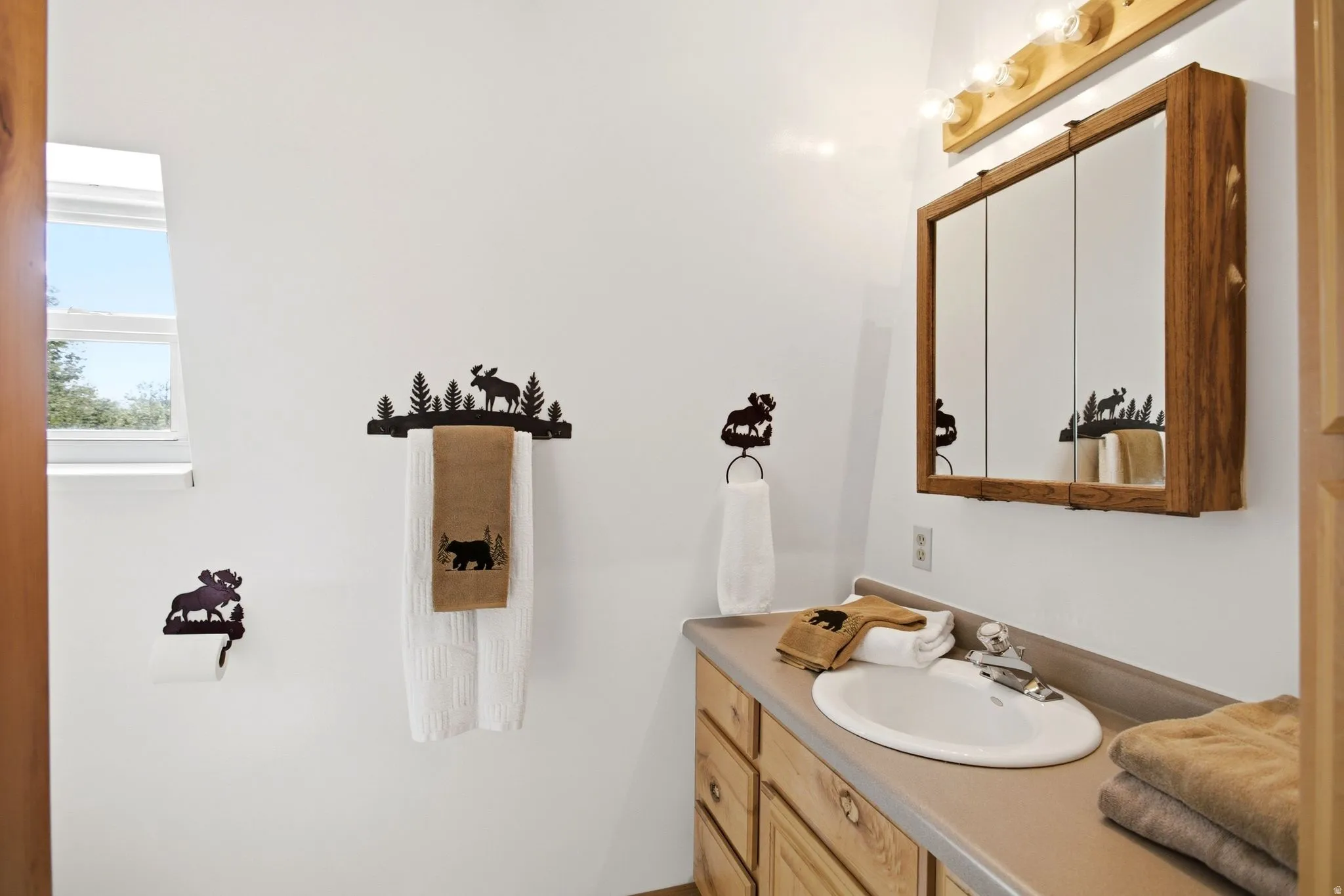 3/4 Bathroom featuring wood-finish cabinetry