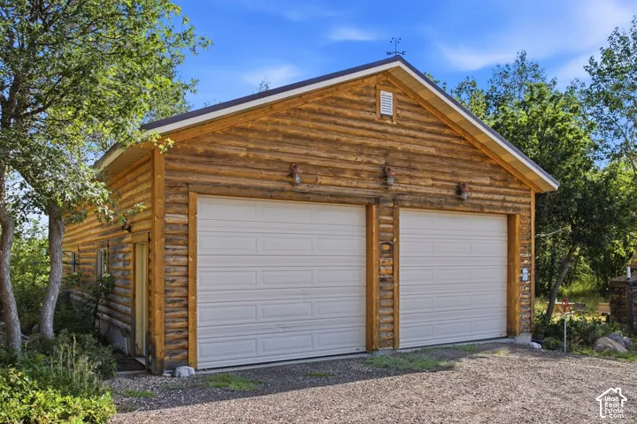 Massive oversize garage for vehicles and RV's. Workshop or whatever a man-cave needs these days.