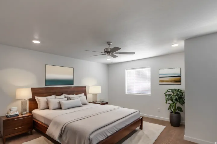 Spacious room featuring neutral-toned walls, recessed lighting, and a ceiling fan