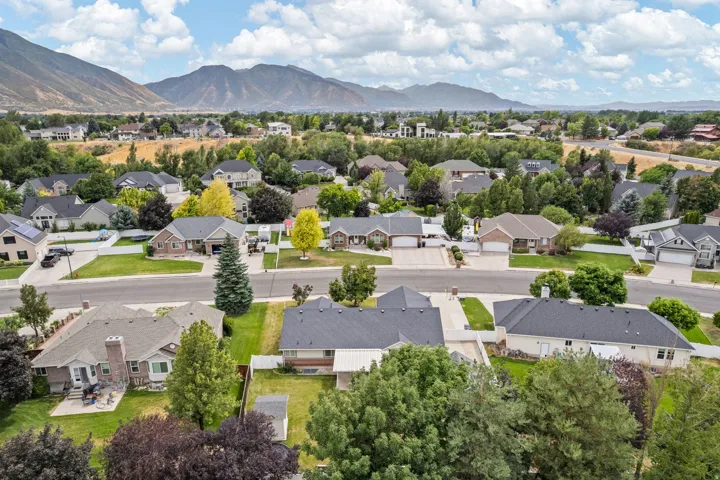 Expansive residential neighborhood featuring numerous single-family homes, mature landscaping, and paved streets