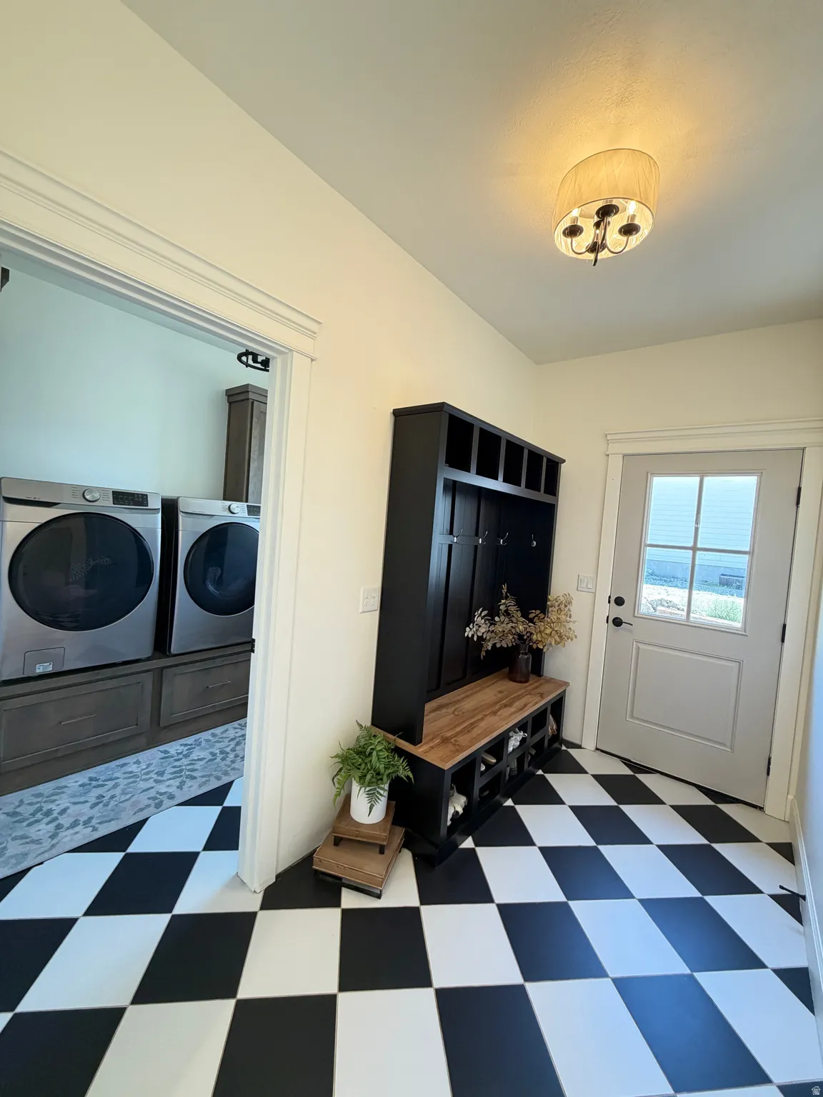 Entryway from the south eaturing bold black and white checkered flooring