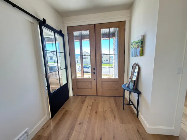 French Doors to the inviting vestibule