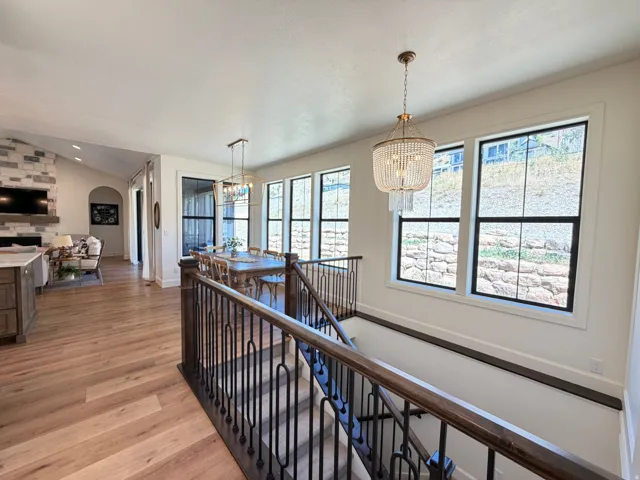 Staircase featuring dark wood handrails and black metal balusters
