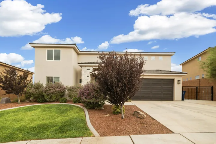 Two-story stucco exterior with a stone facade accent