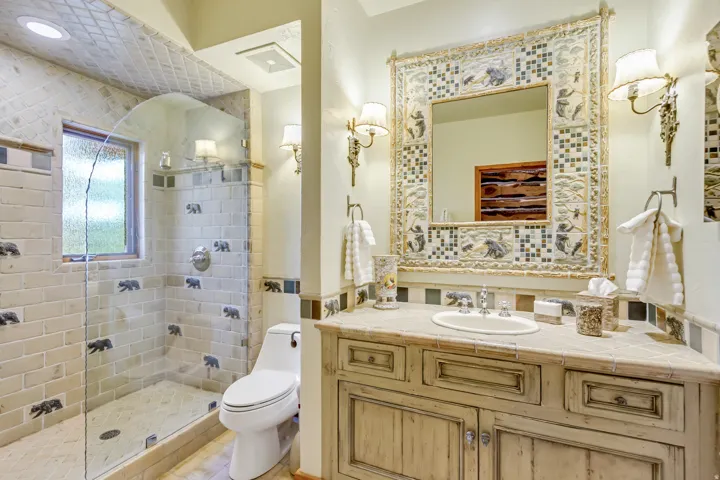 Bathroom with a tiled walk-in shower featuring a glass enclosure and frosted window
