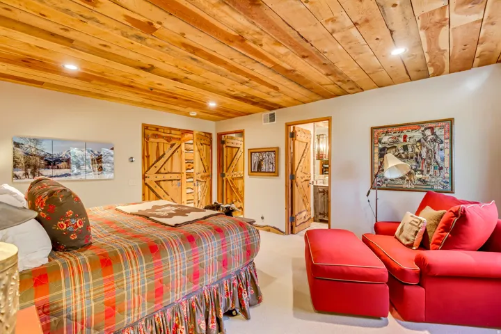 Wood-paneled ceiling with recessed lighting