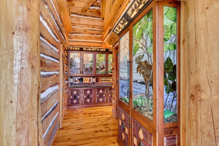 Rustic log wall construction with exposed beams