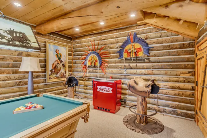 Entertainment area featuring a billiards table, log wall construction, wood-finish ceiling, and recessed lighting