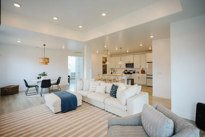 Open-concept living area featuring light wood-finish flooring and recessed lighting throughout