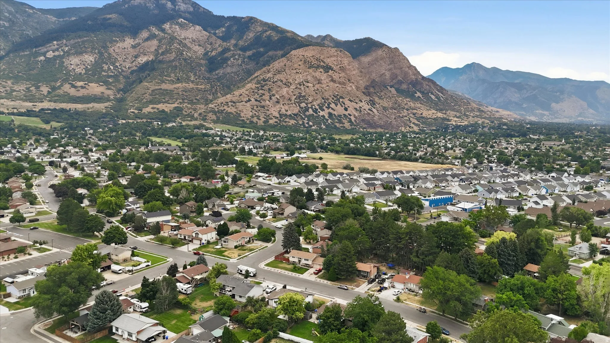Expansive aerial perspective showcasing a residential development with varied housing styles