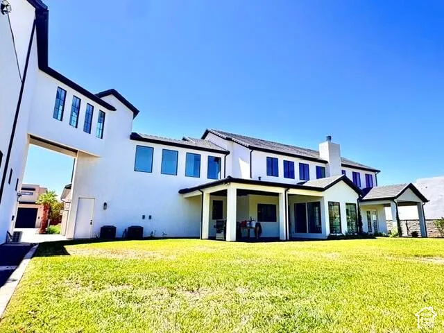 Contemporary multi-story exterior with white stucco finish and contrasting black trim