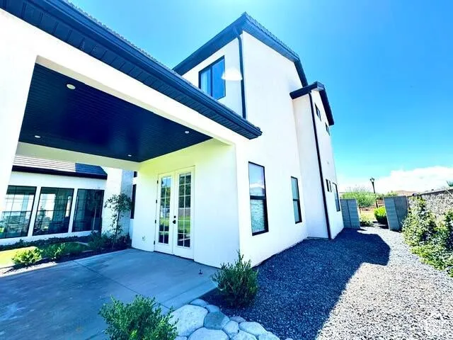 Contemporary exterior featuring white stucco and black trim accents