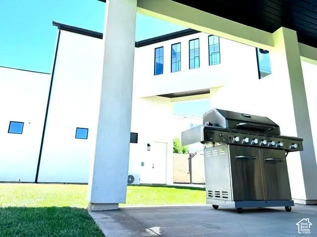 Covered outdoor patio with concrete flooring