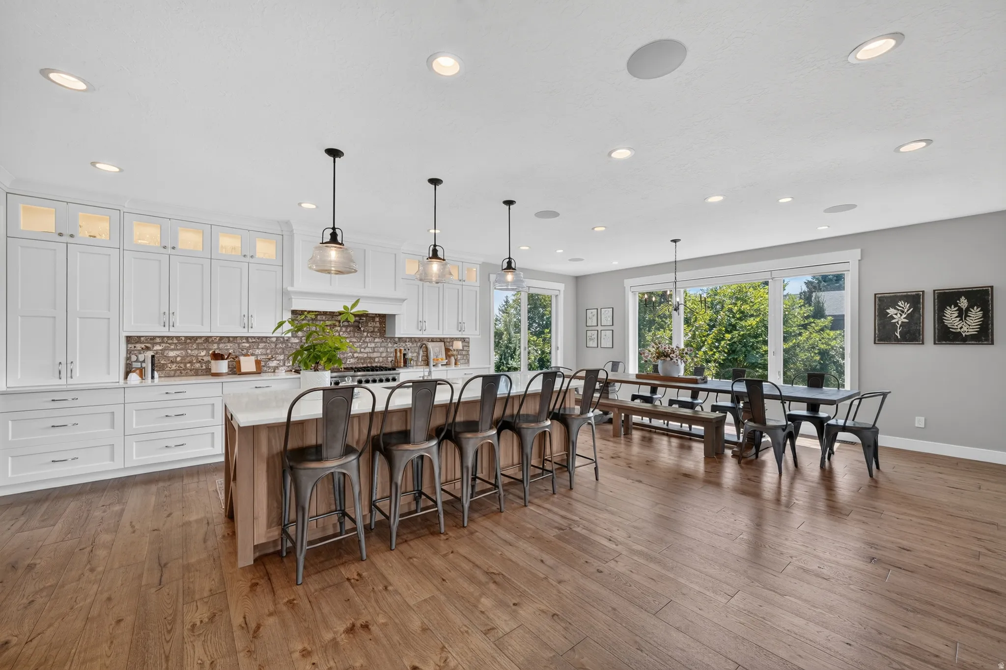 Open-concept kitchen and dining area with wood-finish flooring