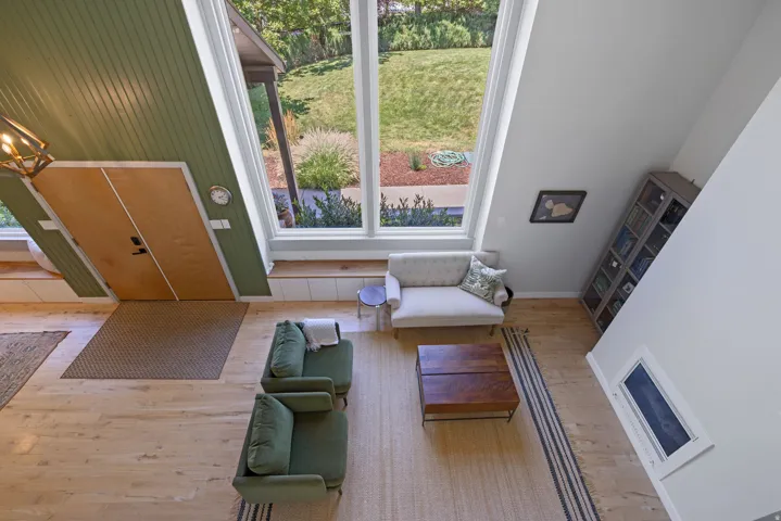 Vaulted ceilings featuring expansive windows