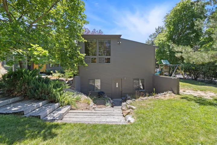 Multi-level contemporary exterior with a dark gray facade