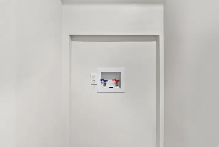 Recessed laundry hookups with hot and cold water valves, and a dedicated electrical outlet