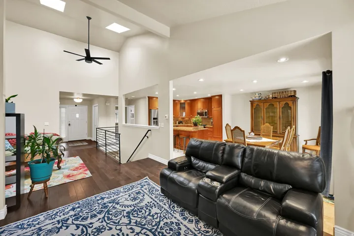 Vaulted ceilings featuring recessed lighting and skylights create an open ambiance